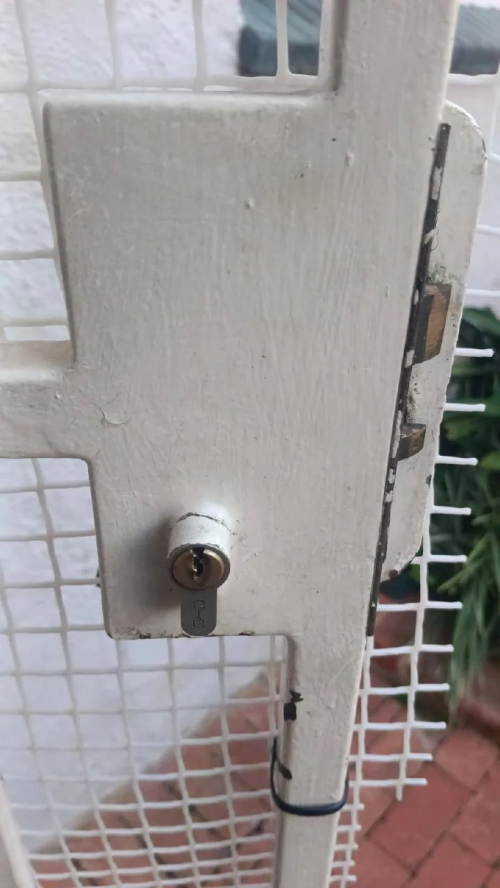 Security gate lock fitted to a steel gate on a residential property